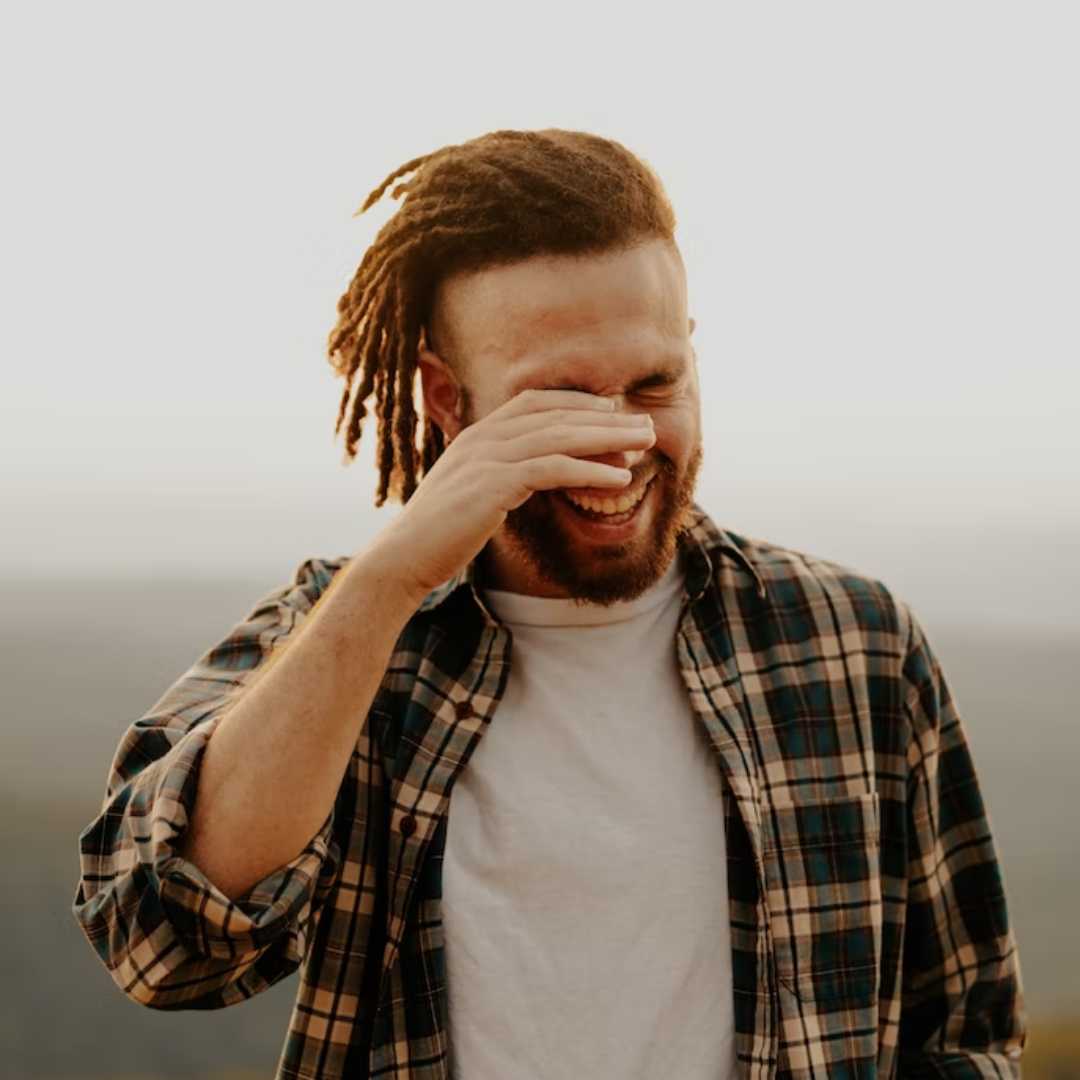 Men wearing Men’s White Original Fit Crewneck  Thompson Tee under flannel shirt